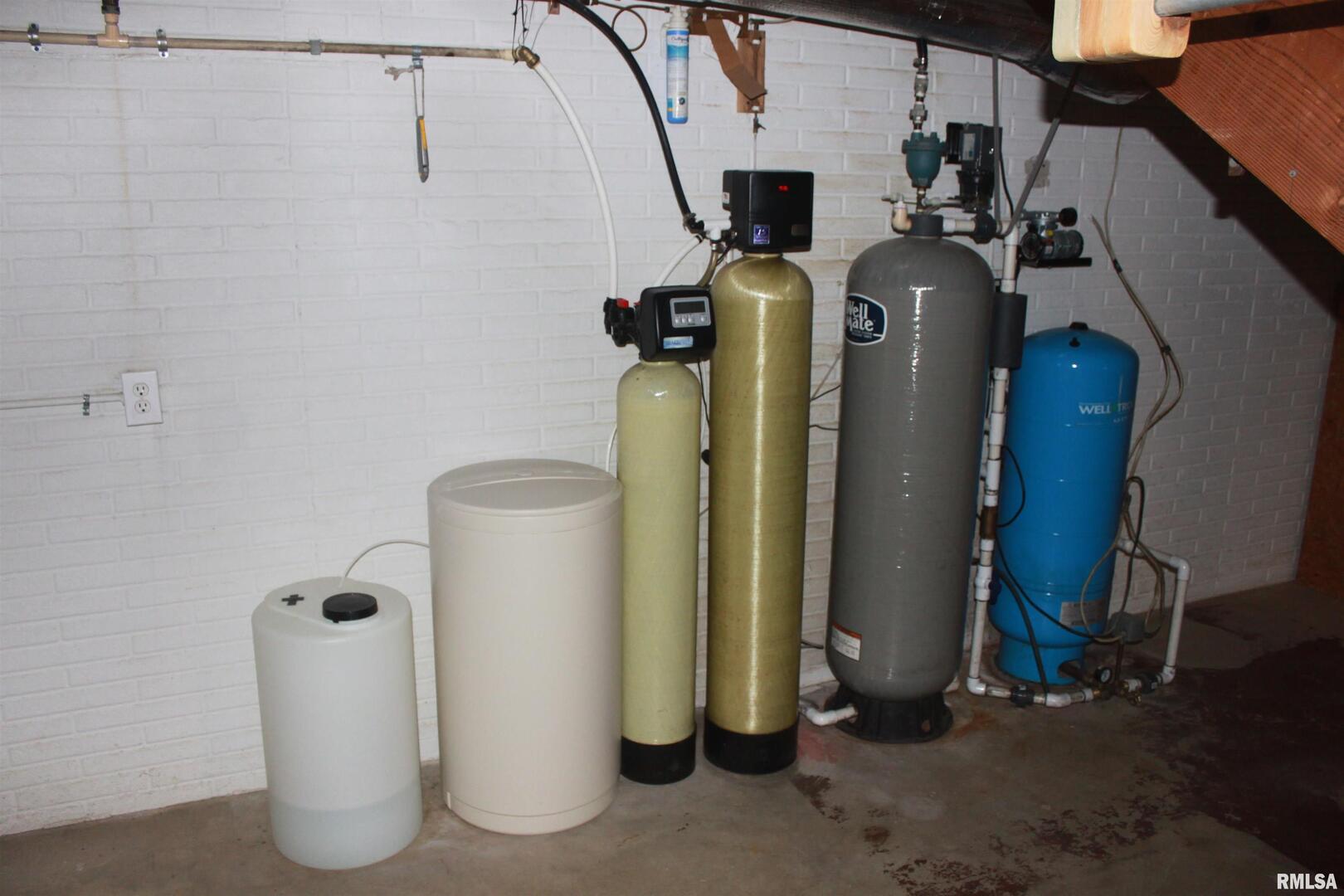 9012 98th Street West Taylor Ridge, IL 61284 - Photo 16 of 18 a view of storage and utility room with refrigerator and window