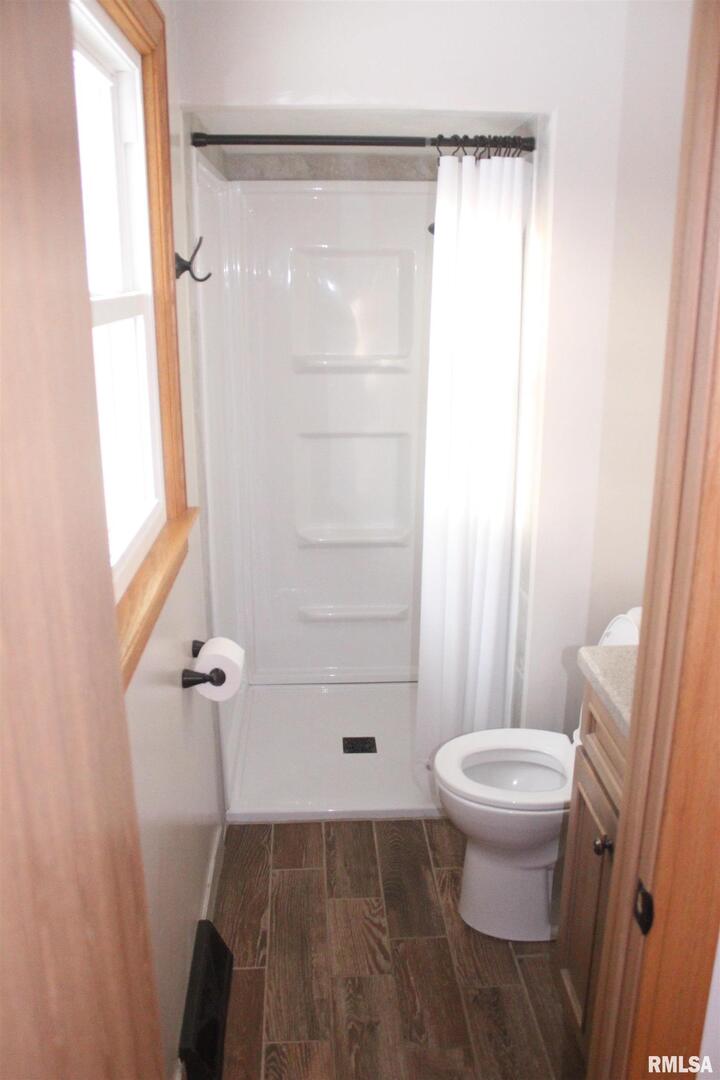 9012 98th Street West Taylor Ridge, IL 61284 - Photo 10 of 18 a bathroom with a shower and a toilet