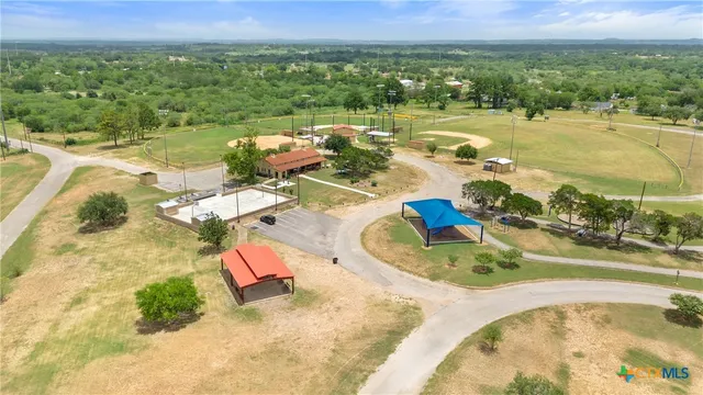 an aerial view of a house with outdoor space