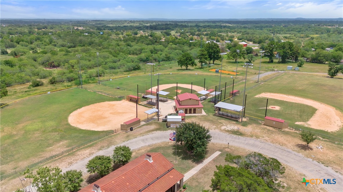 1140 North Hackberry Avenue Luling, TX 78648 - Photo 18 of 20 an outdoor sitting area with furniture and garden
