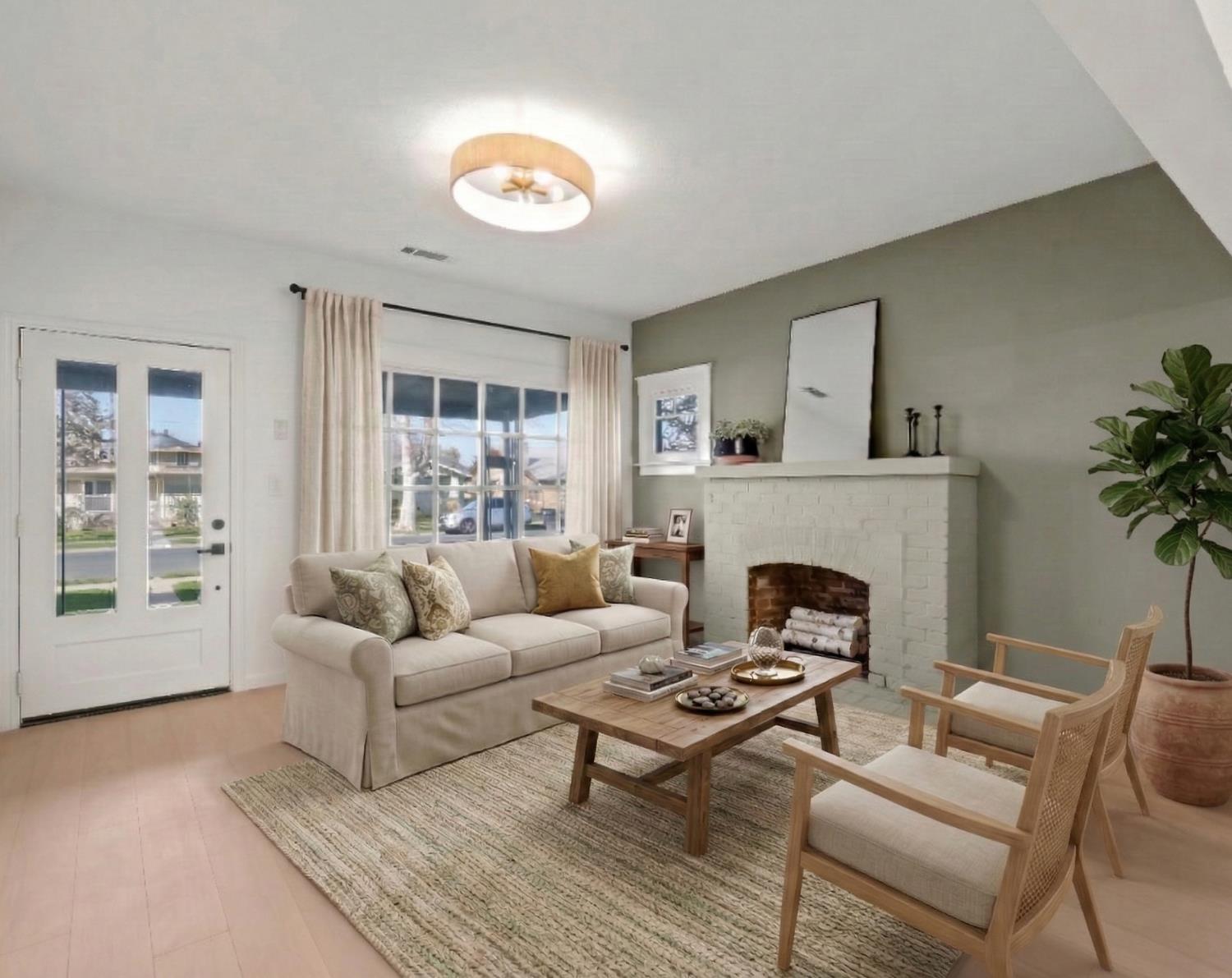 425 West Elm Street Hanford, CA 93230 - Photo 1 of 18 a living room with furniture and a fireplace