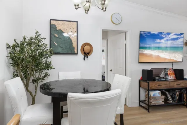 a kitchen with a table and chairs