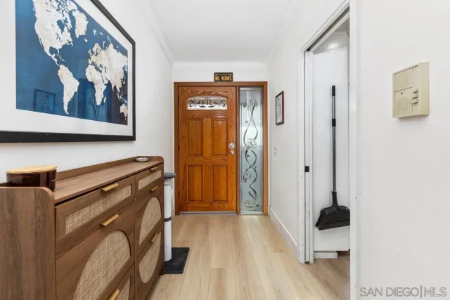a view of a hallway with paintings on the wall