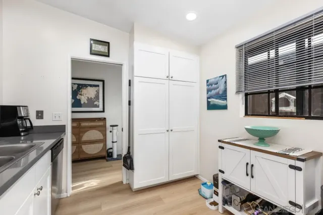 a kitchen with a refrigerator and a sink