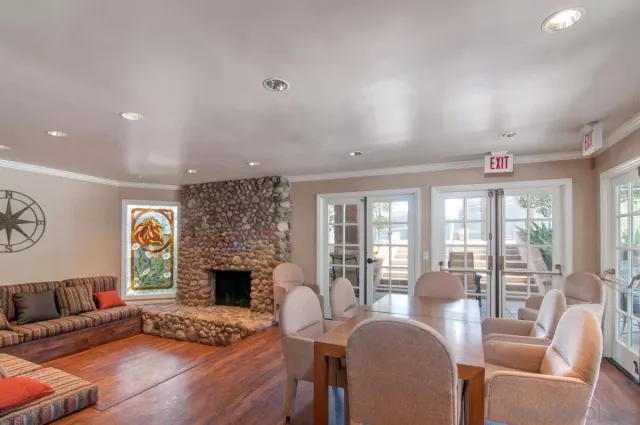 a view of a backyard with plants and outdoor seating