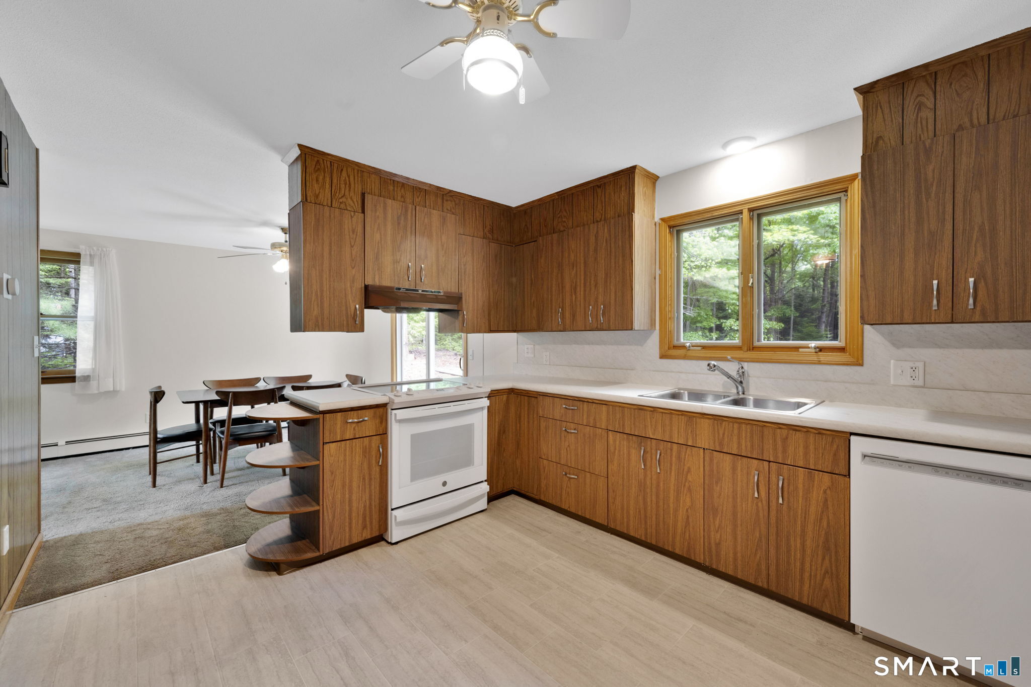 158 Notch Road Granby, CT 06035 - Photo 5 of 40 a kitchen with a sink stove and cabinets