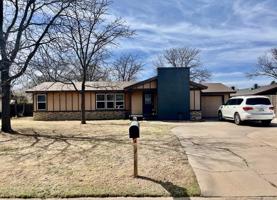1209 Xenia Street Plainview, TX 79072 - Photo 1 of 31 a car parked in front of white house
