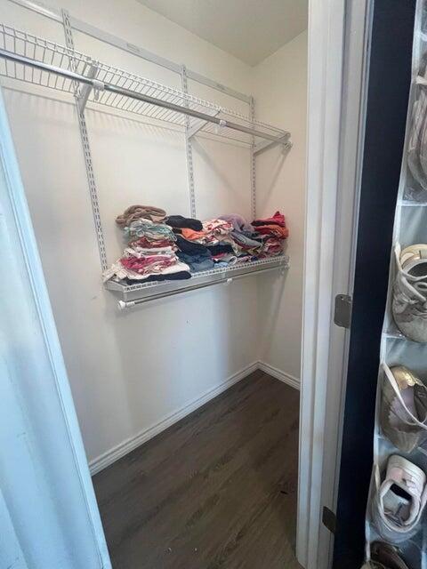 1209 Xenia Street Plainview, TX 79072 - Photo 20 of 31 a view of walk in closet with clothes and shoes