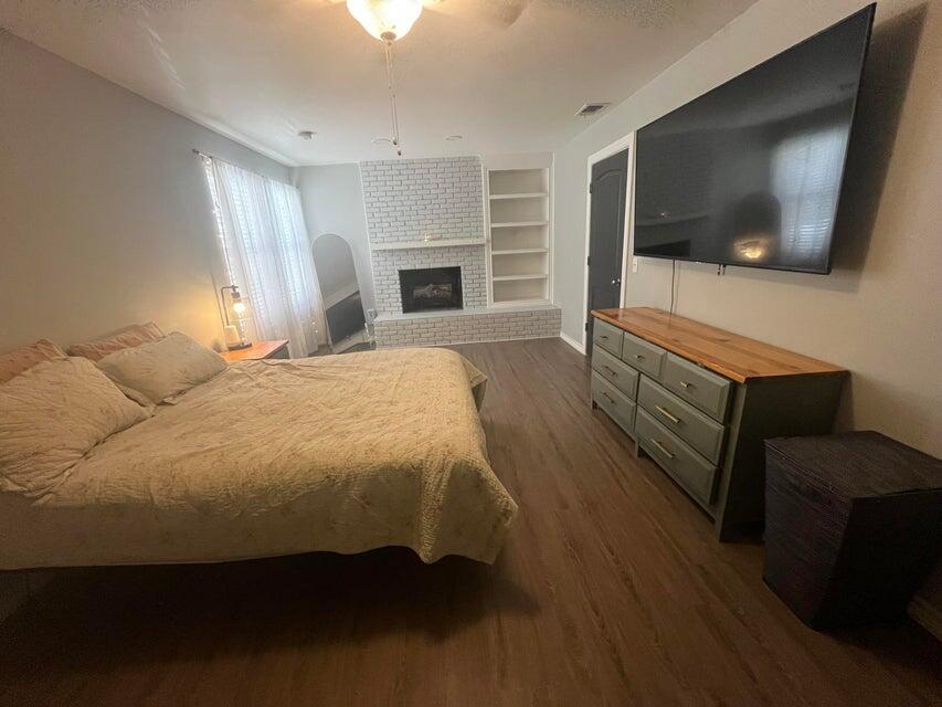 1209 Xenia Street Plainview, TX 79072 - Photo 21 of 31 a bedroom with a bed and a flat screen tv