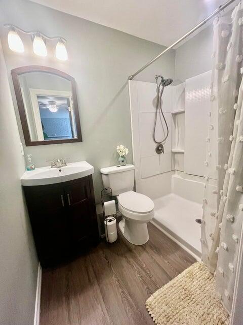 1209 Xenia Street Plainview, TX 79072 - Photo 24 of 31 a bathroom with a sink toilet and shower