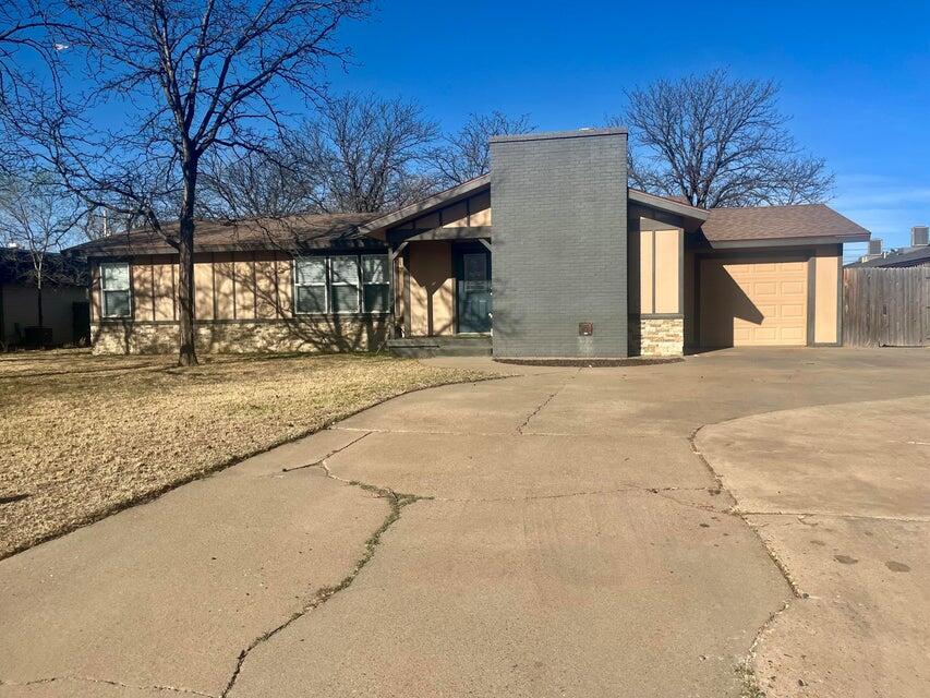 1209 Xenia Street Plainview, TX 79072 - Photo 3 of 31 a view of a house with a outdoor space