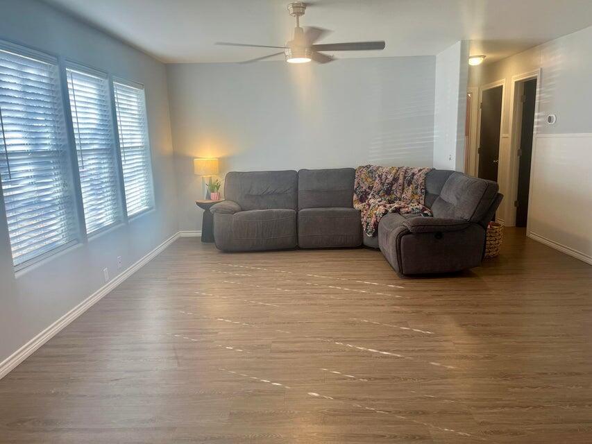 1209 Xenia Street Plainview, TX 79072 - Photo 6 of 31 a living room with furniture and a large window