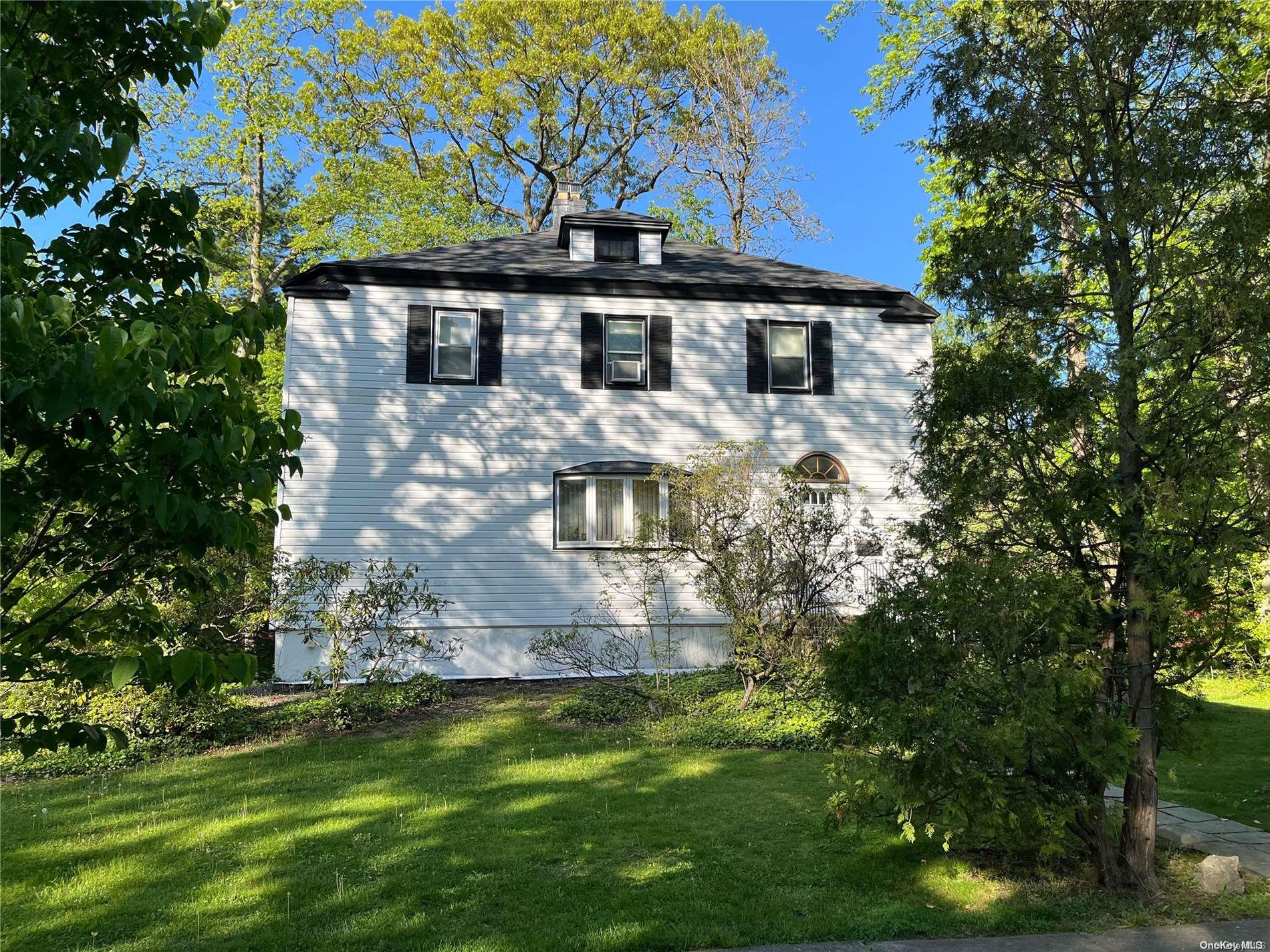 25 Crescent Road Great Neck, NY 11021 - Photo 1 of 1 a front view of a house with a yard