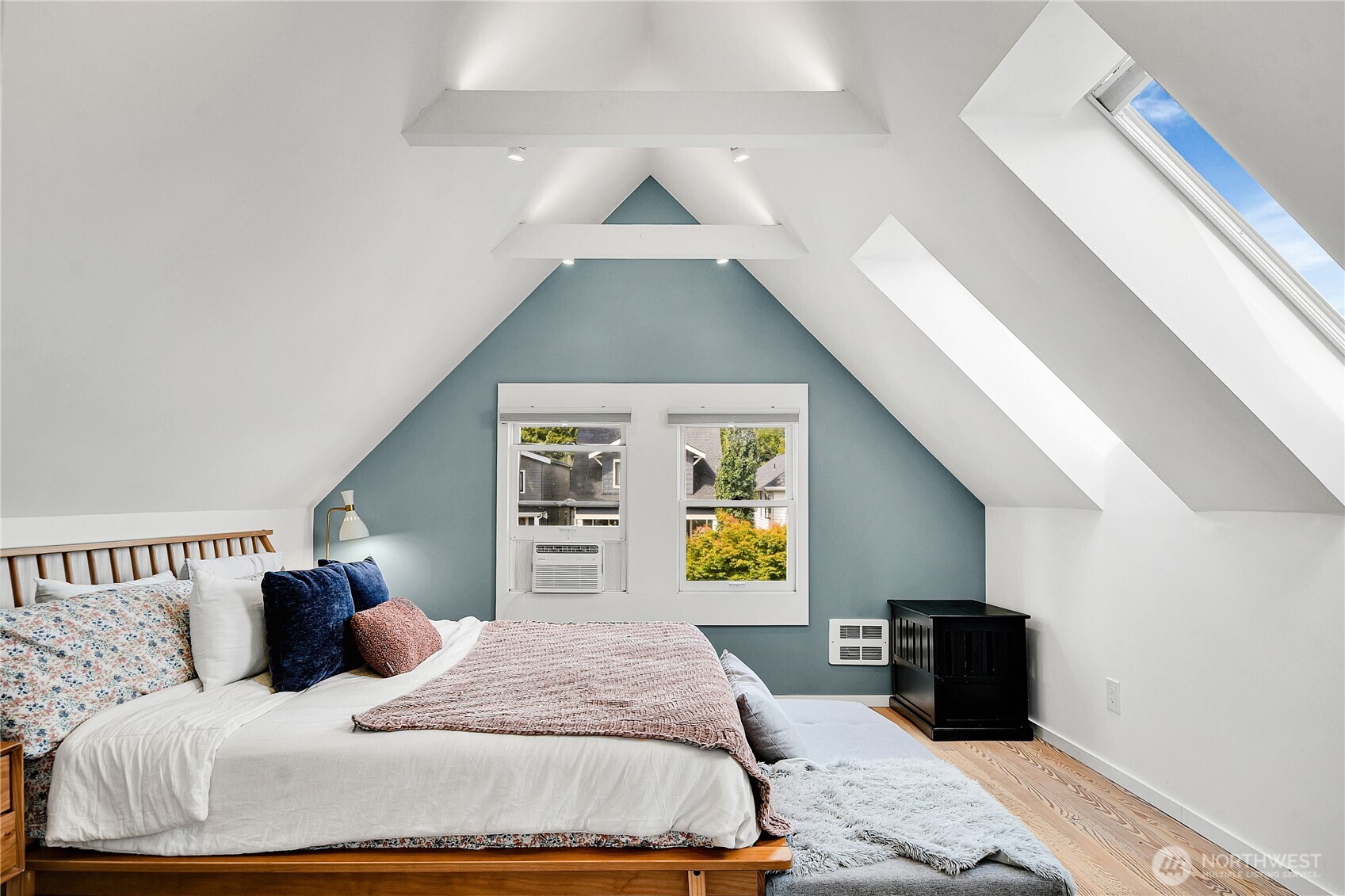 1930 5th Avenue West Seattle, WA 98119 - Photo 18 of 28 a bedroom with a bed and wooden floor