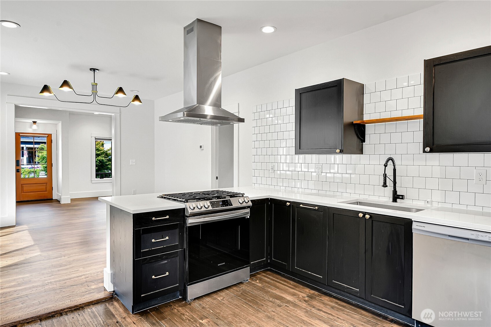 1930 5th Avenue West Seattle, WA 98119 - Photo 7 of 28 a kitchen with stainless steel appliances a sink stove and cabinets