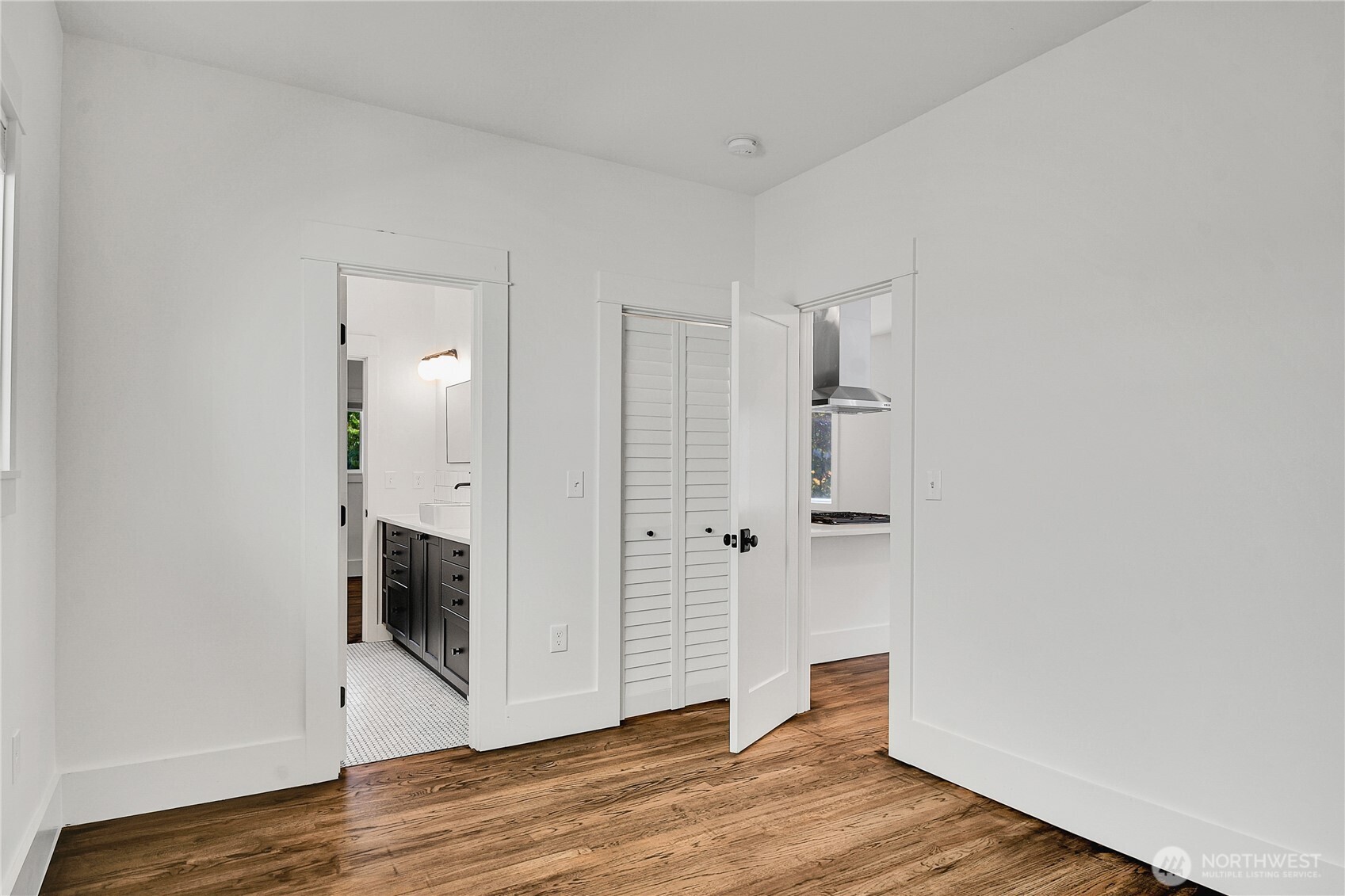 1930 5th Avenue West Seattle, WA 98119 - Photo 9 of 28 a view of a hallway with wooden floor and cabinets