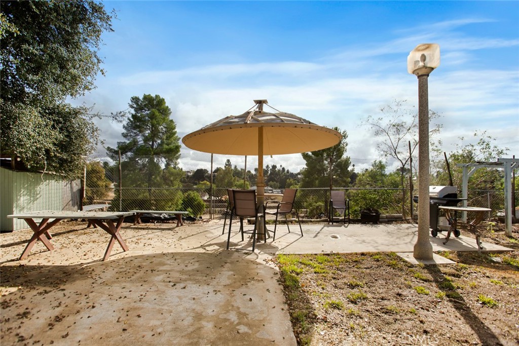 34863 Wildwood Canyon Road Yucaipa, CA 92399 - Photo 16 of 21 a swimming pool with outdoor seating