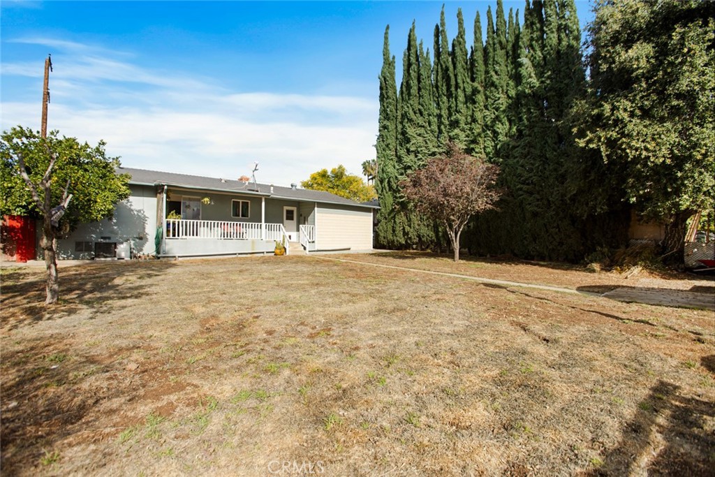 34863 Wildwood Canyon Road Yucaipa, CA 92399 - Photo 20 of 21 a front view of a house with a yard