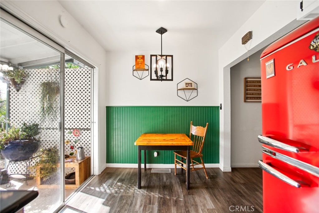 34863 Wildwood Canyon Road Yucaipa, CA 92399 - Photo 8 of 21 a view of a room with wooden floor table and chairs