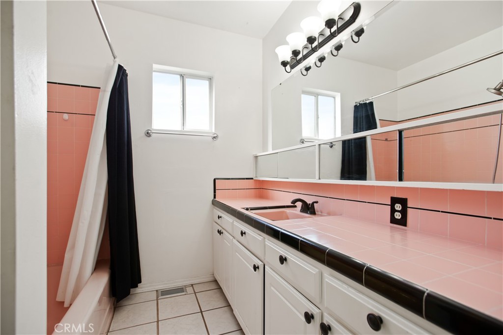 34863 Wildwood Canyon Road Yucaipa, CA 92399 - Photo 10 of 21 a bathroom with a double vanity sink and a mirror