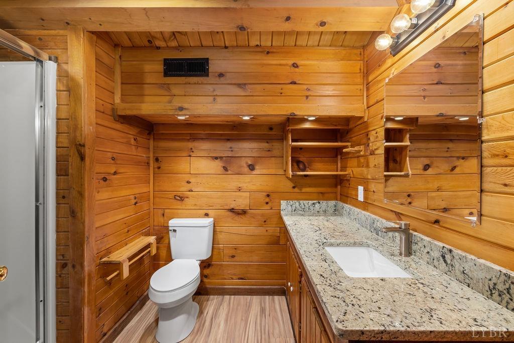 564 Thistle Road Rustburg, VA 24588 - Photo 43 of 47 a bathroom with a granite countertop toilet and a sink