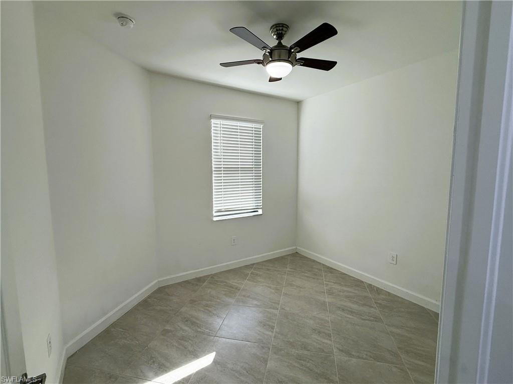 14063 Winding Cedar Way Fort Myers, FL 33913 - Photo 12 of 15 an empty room with a window and a fan