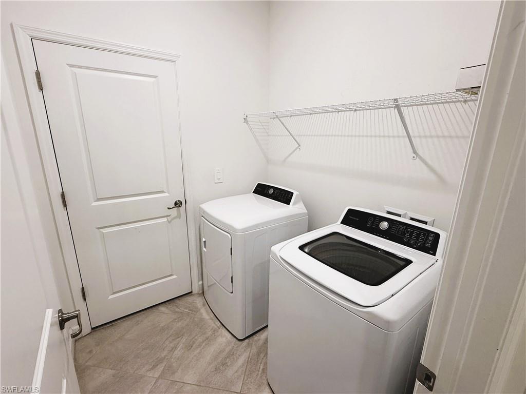 14063 Winding Cedar Way Fort Myers, FL 33913 - Photo 15 of 15 a utility room with dryer and washer