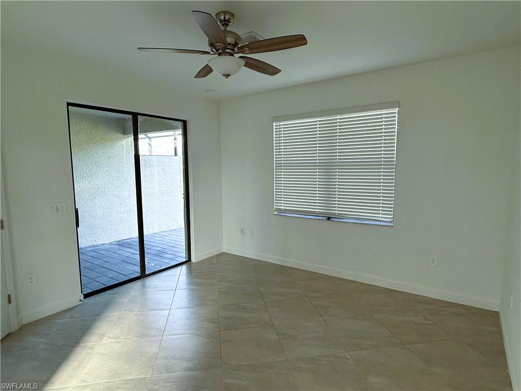 14063 Winding Cedar Way Fort Myers, FL 33913 - Photo 9 of 15 an empty room with fan and windows