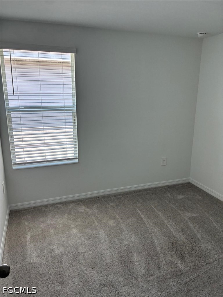 12441 Dakota Ridge Place Lehigh Acres, FL 33974 - Photo 12 of 16 an empty room with a window