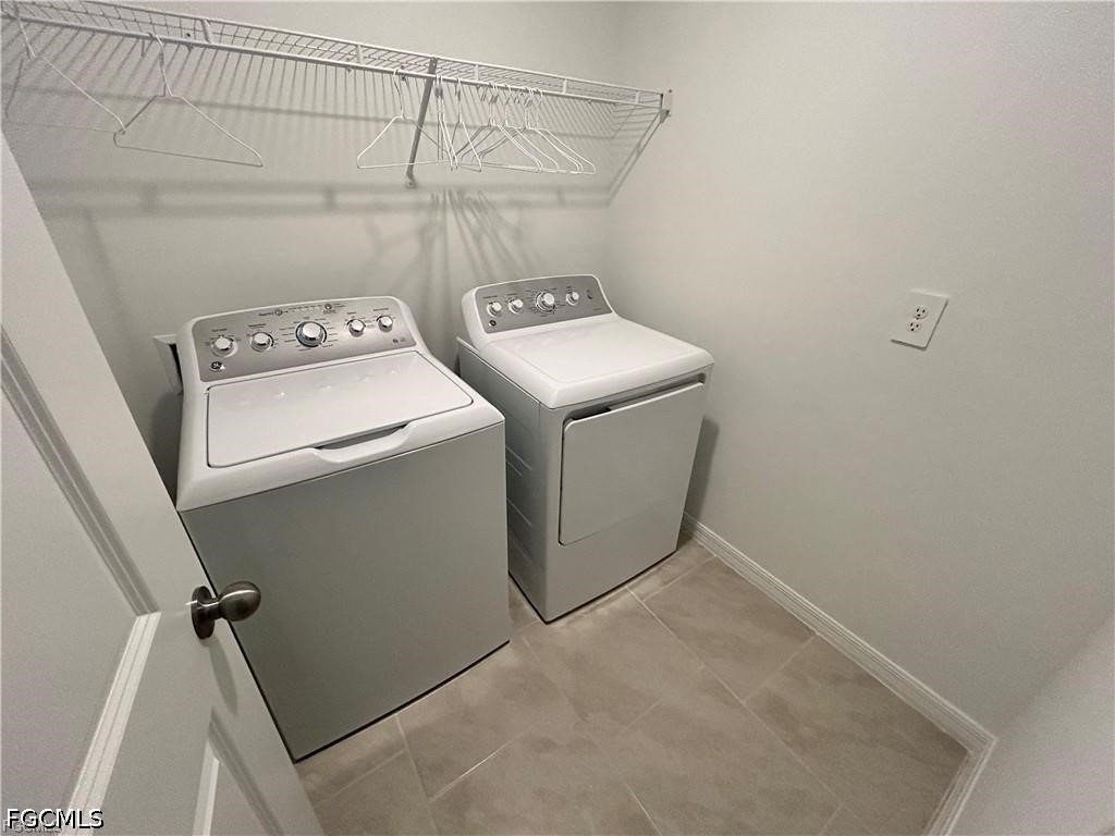 12441 Dakota Ridge Place Lehigh Acres, FL 33974 - Photo 14 of 16 a utility room with dryer and washer