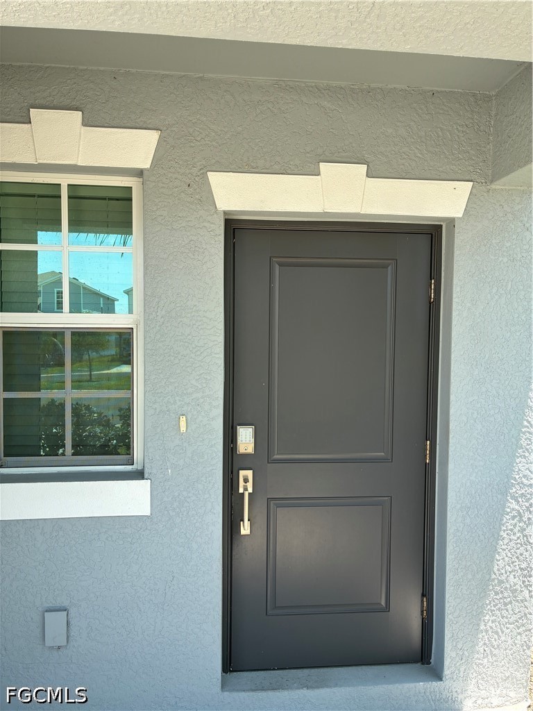 12441 Dakota Ridge Place Lehigh Acres, FL 33974 - Photo 2 of 16 a view of a door of a house