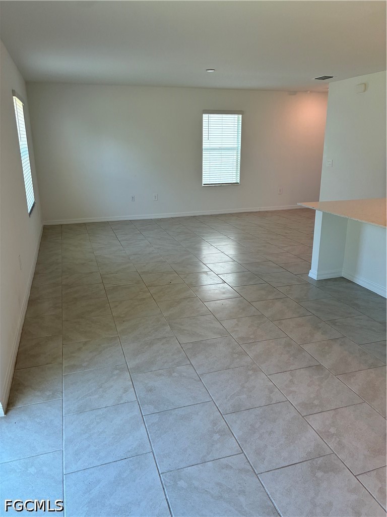 12441 Dakota Ridge Place Lehigh Acres, FL 33974 - Photo 4 of 16 a view of a livingroom with an empty space and a window