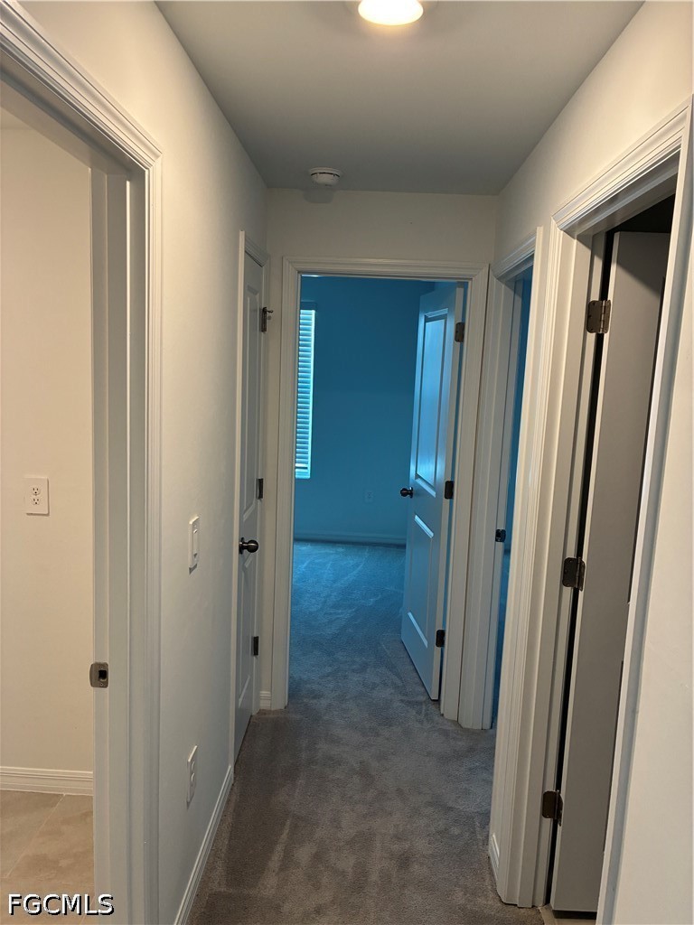 12441 Dakota Ridge Place Lehigh Acres, FL 33974 - Photo 5 of 16 a view of a bathroom from a hallway
