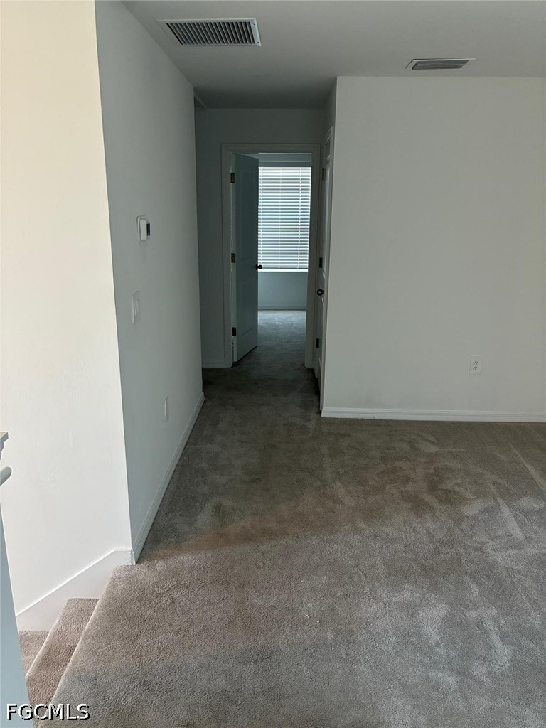 12441 Dakota Ridge Place Lehigh Acres, FL 33974 - Photo 9 of 16 an empty room with a bathroom