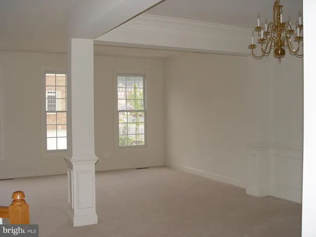 a view of empty room with windows