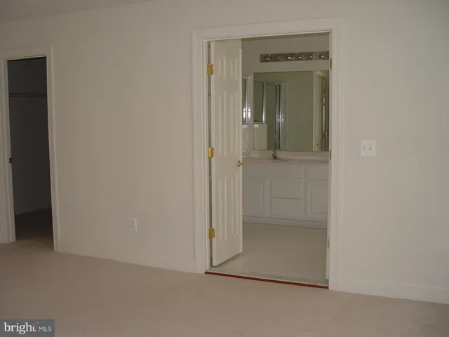 a living room with a fireplace and windows