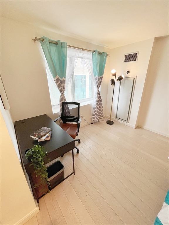 10 Museum Way, Unit 321 Cambridge, MA 02141 - Photo 6 of 15 a living room with furniture