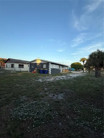 a view of a big yard with an outdoor space