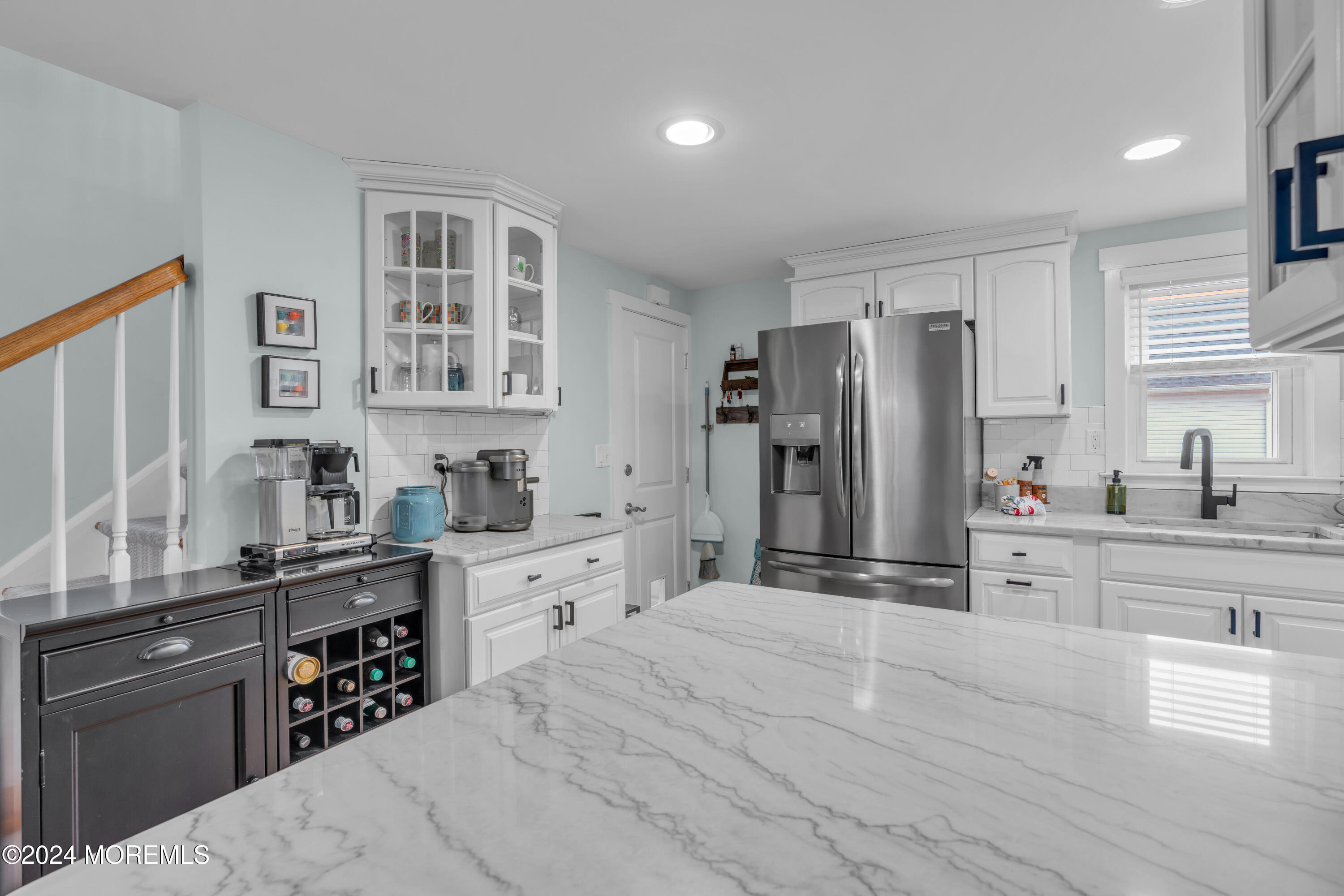 96 Manito Road Manasquan, NJ 08736 - Photo 17 of 50 a kitchen with granite countertop a refrigerator stove top oven and sink