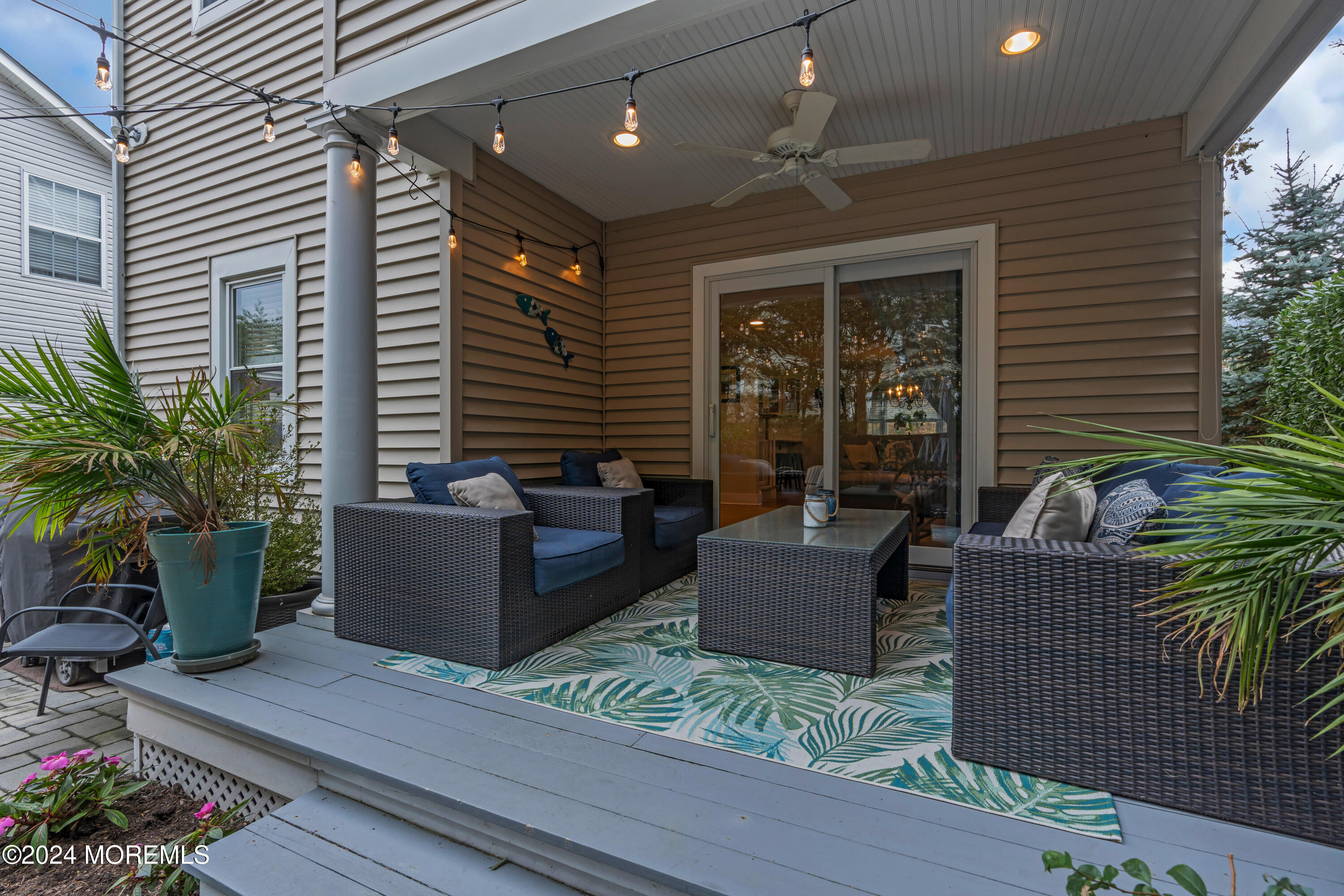 96 Manito Road Manasquan, NJ 08736 - Photo 42 of 50 a balcony with furniture and potted plants