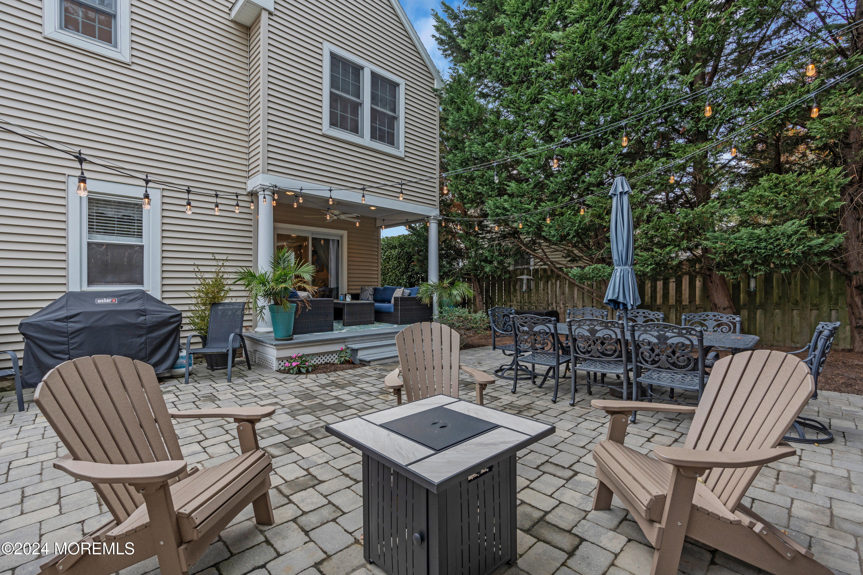 96 Manito Road Manasquan, NJ 08736 - Photo 47 of 50 a view of outdoor sitting area with furniture and wooden floor