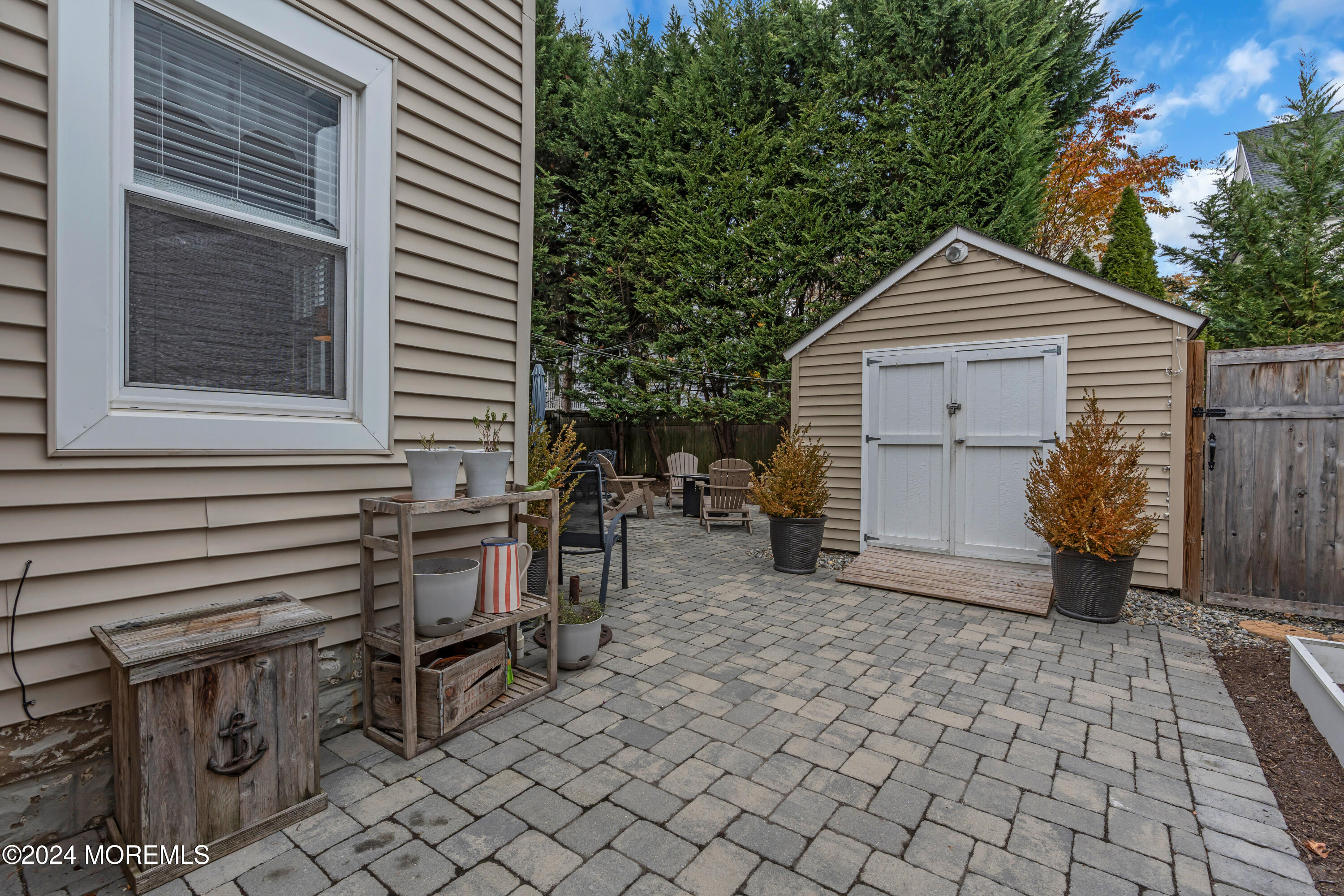 96 Manito Road Manasquan, NJ 08736 - Photo 48 of 50 a view of a house with backyard and sitting area
