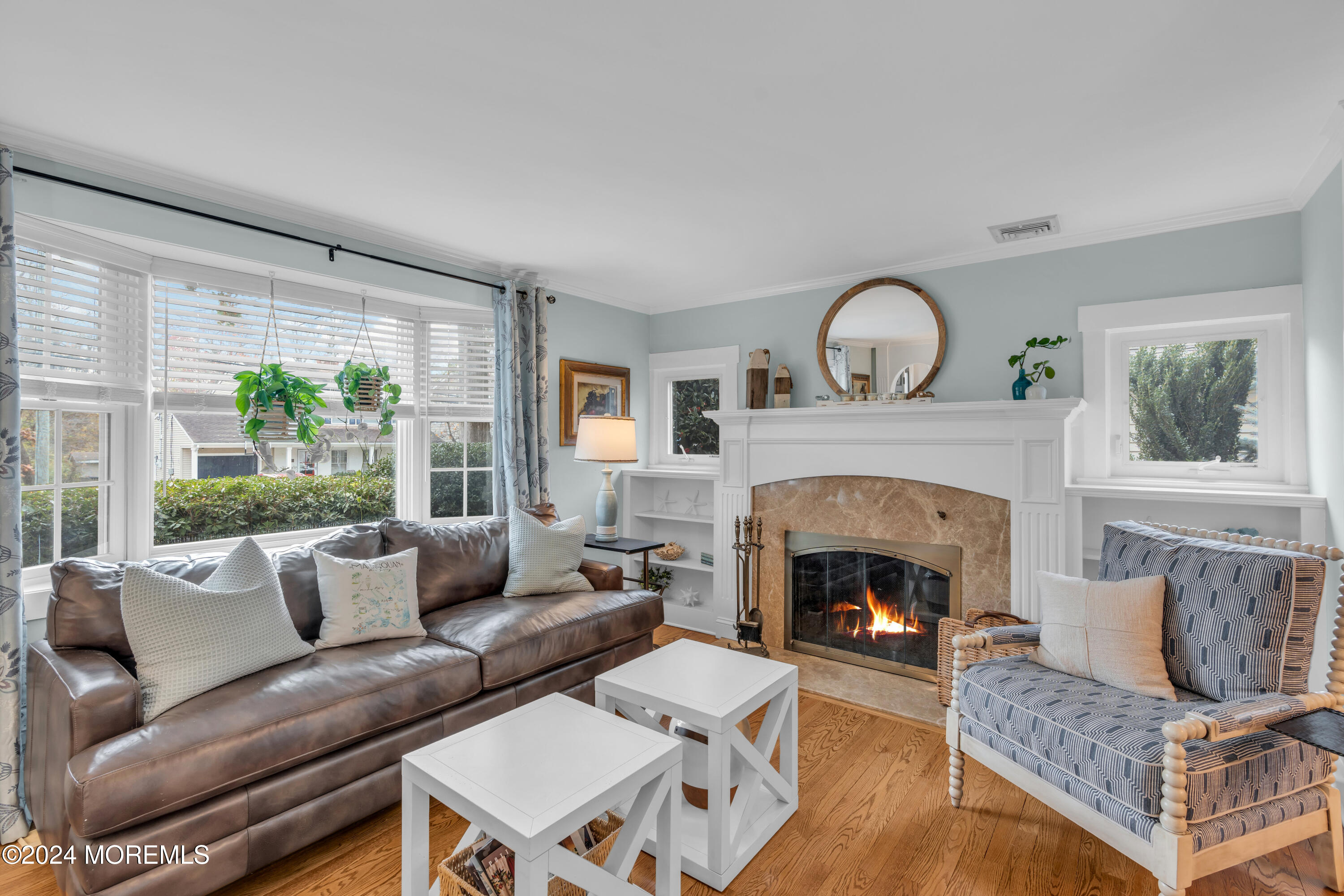 96 Manito Road Manasquan, NJ 08736 - Photo 6 of 50 a living room with furniture and a fireplace