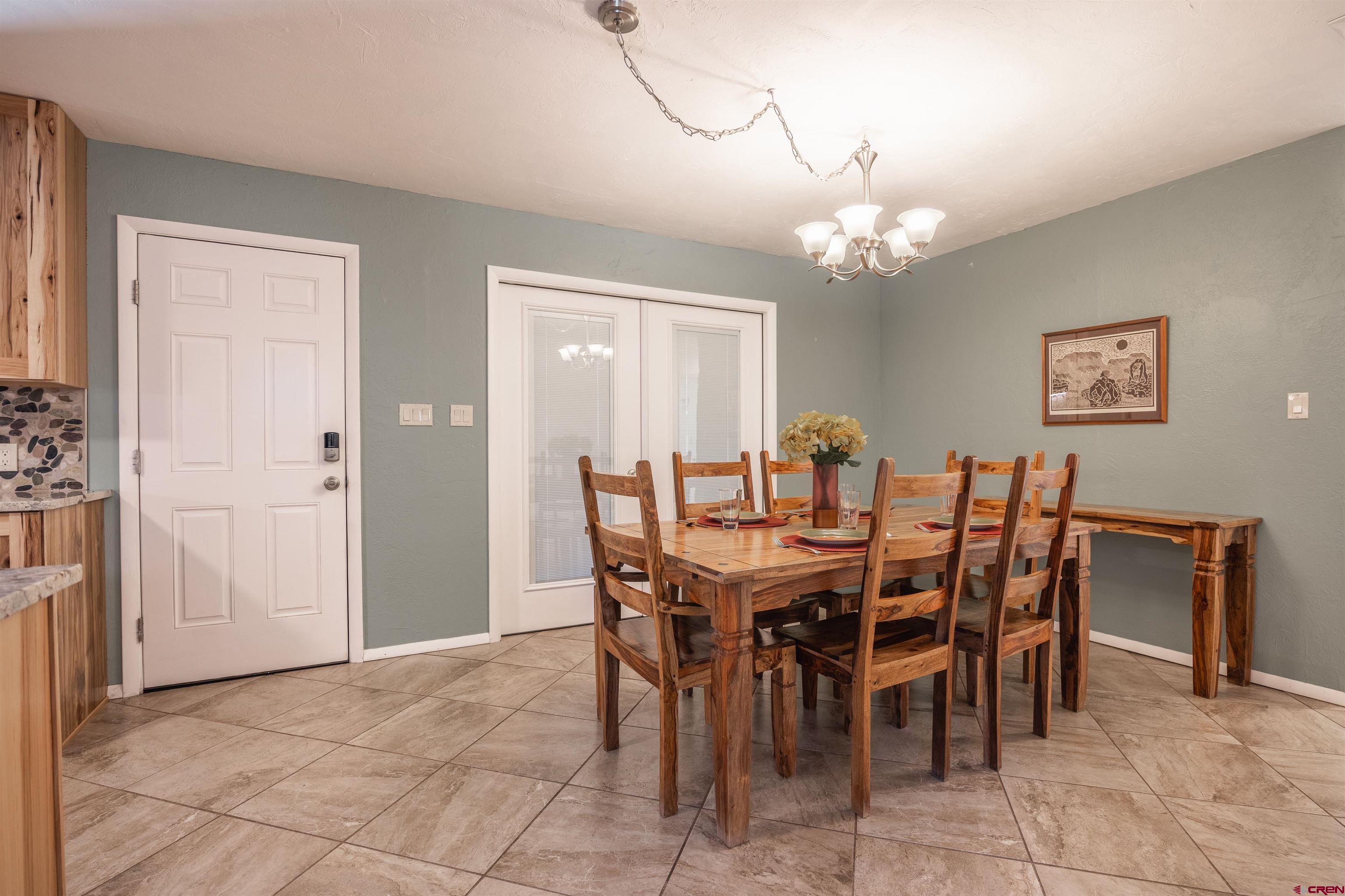 16574 6275th Road Montrose, CO 81403 - Photo 11 of 45 a view of a dining room with furniture