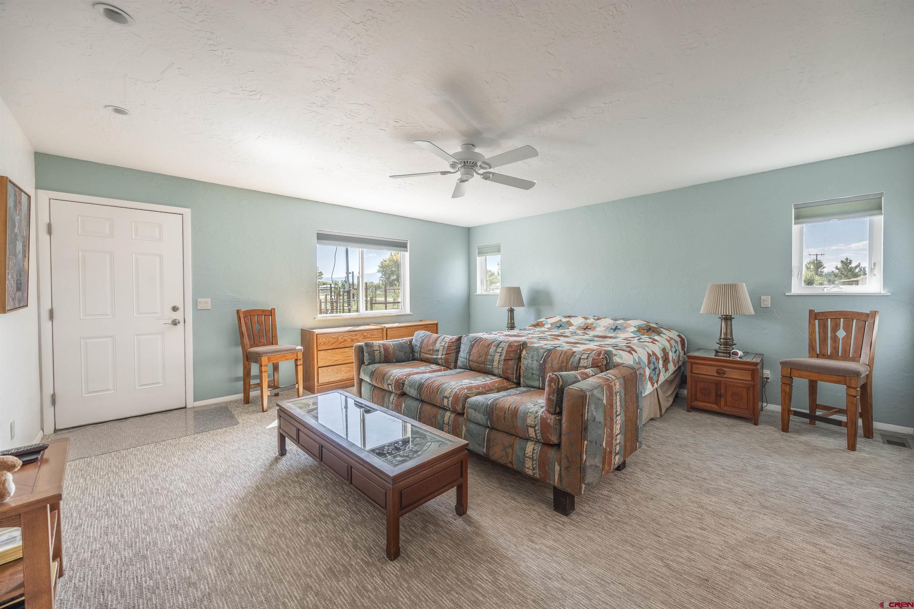 16574 6275th Road Montrose, CO 81403 - Photo 13 of 45 a bedroom with furniture and a window