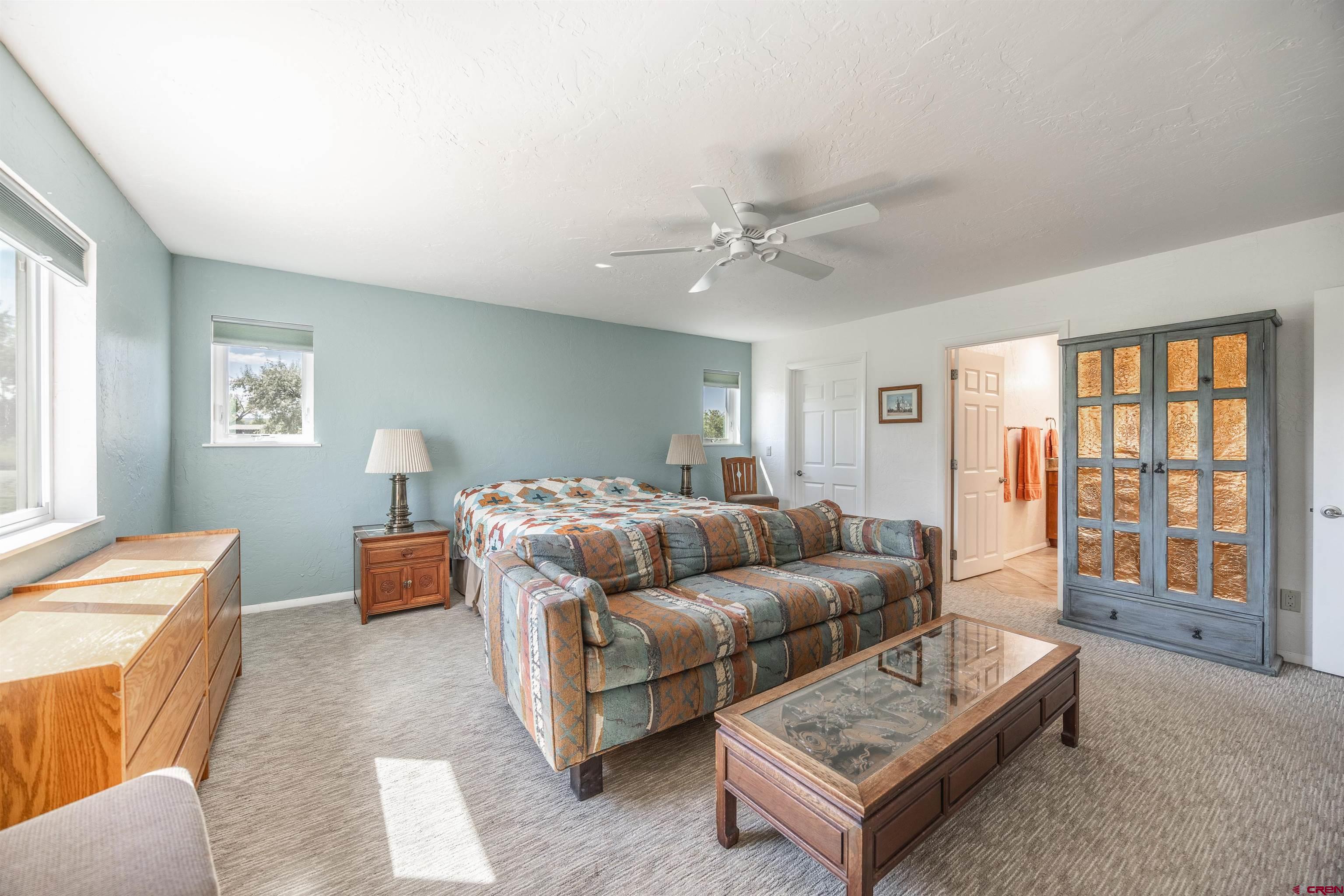 16574 6275th Road Montrose, CO 81403 - Photo 14 of 45 a living room with furniture and a window