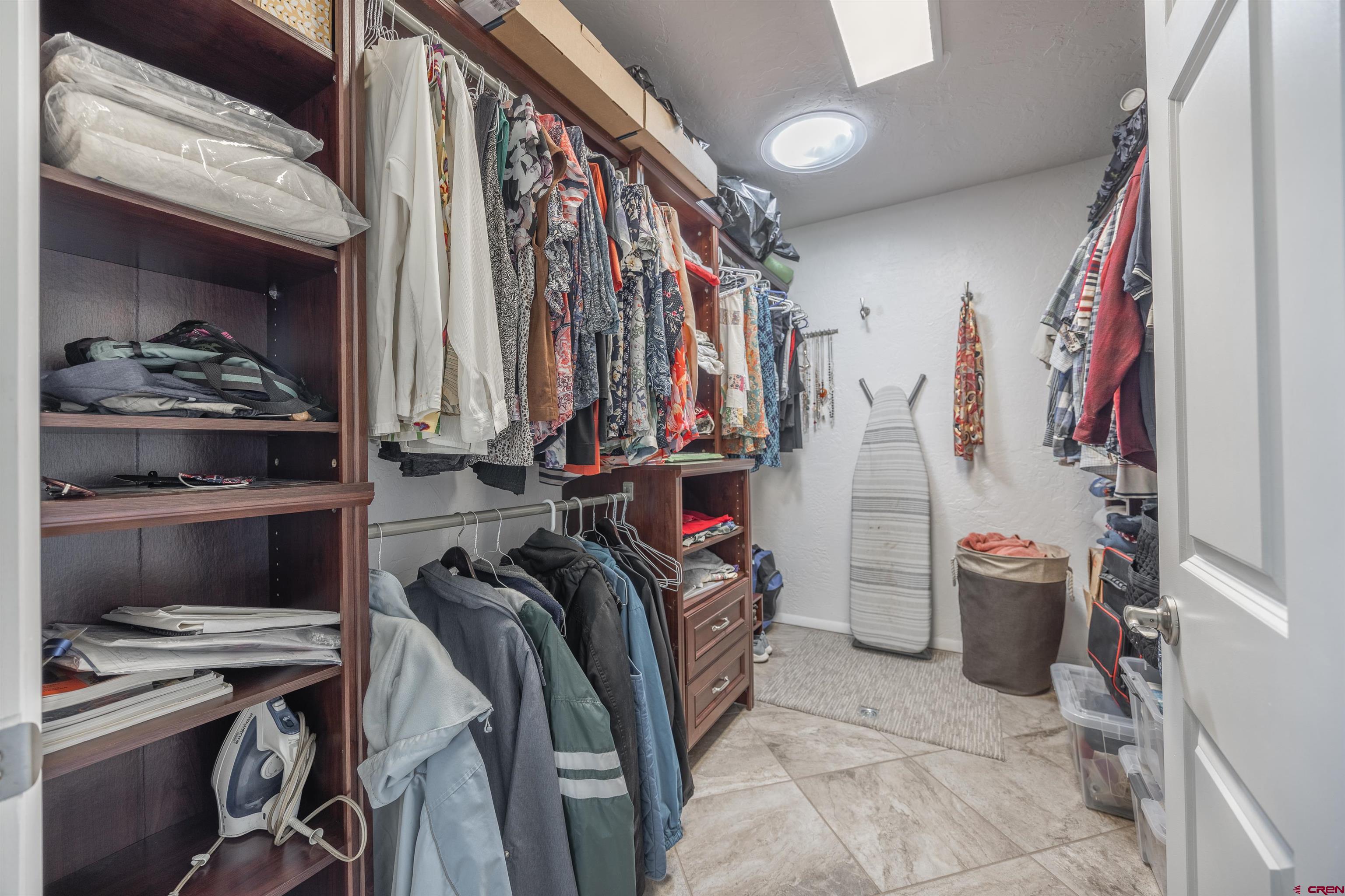 16574 6275th Road Montrose, CO 81403 - Photo 18 of 45 a view of walk in closet with clothes and shoes