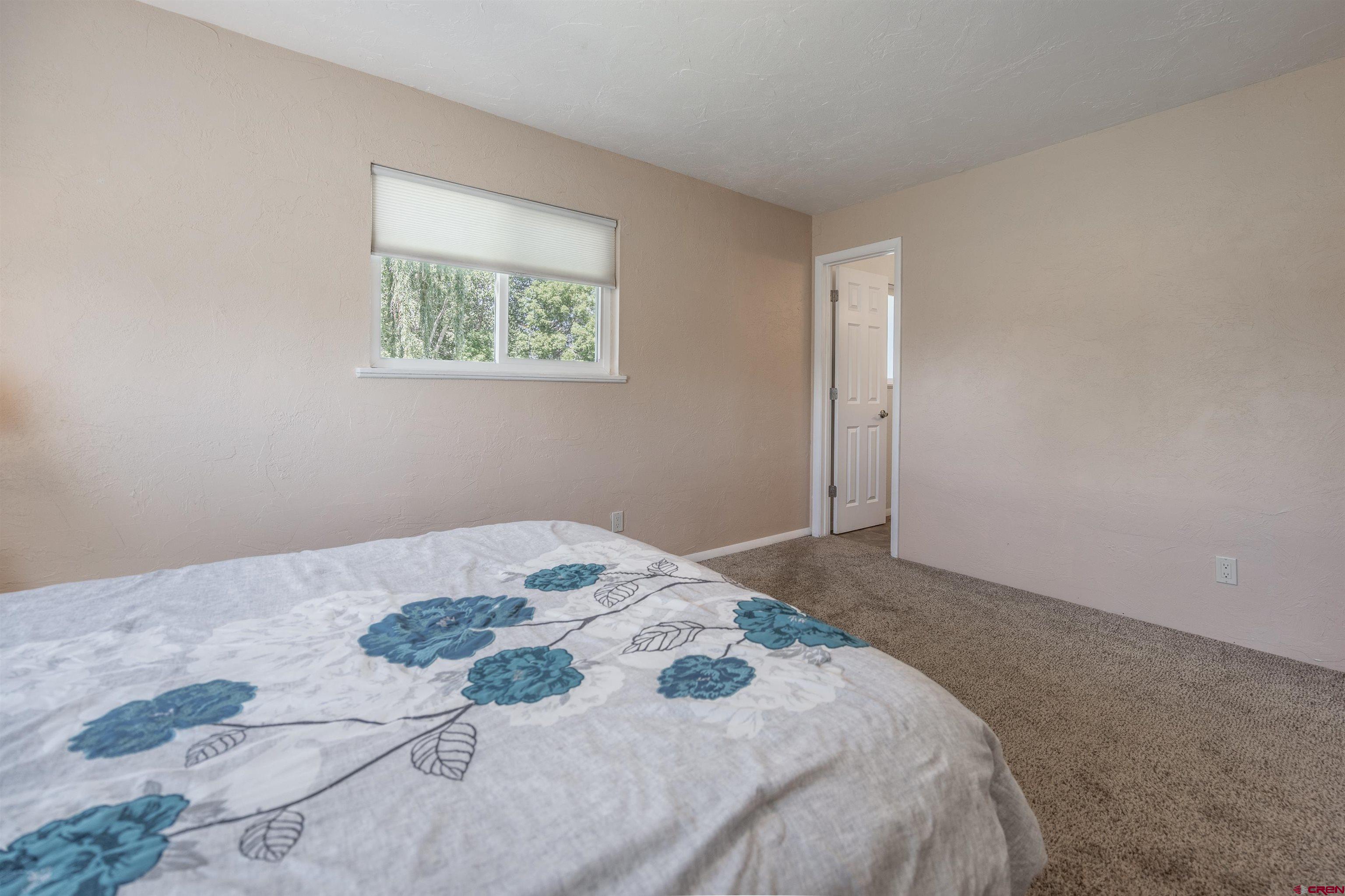 16574 6275th Road Montrose, CO 81403 - Photo 20 of 45 a bedroom with a bed and a window