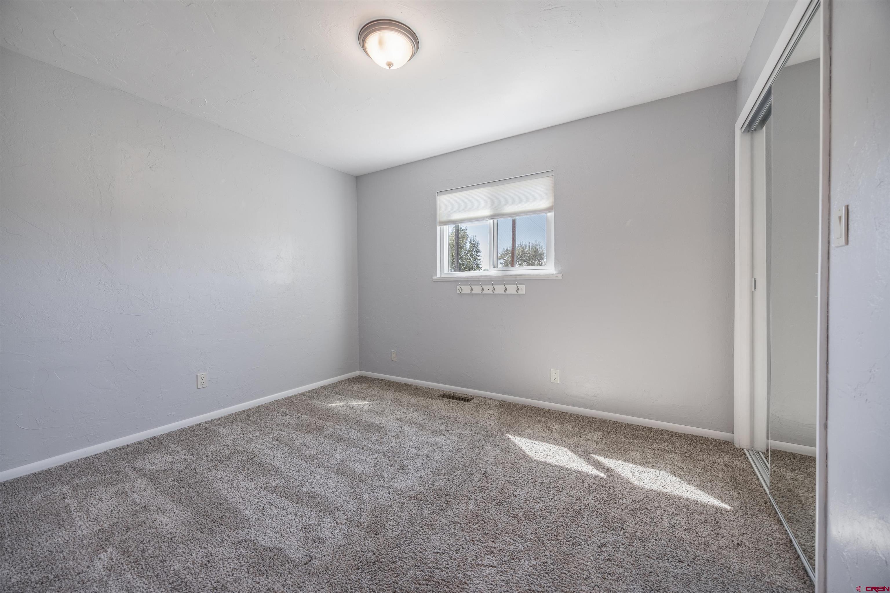 16574 6275th Road Montrose, CO 81403 - Photo 23 of 45 an empty room with windows
