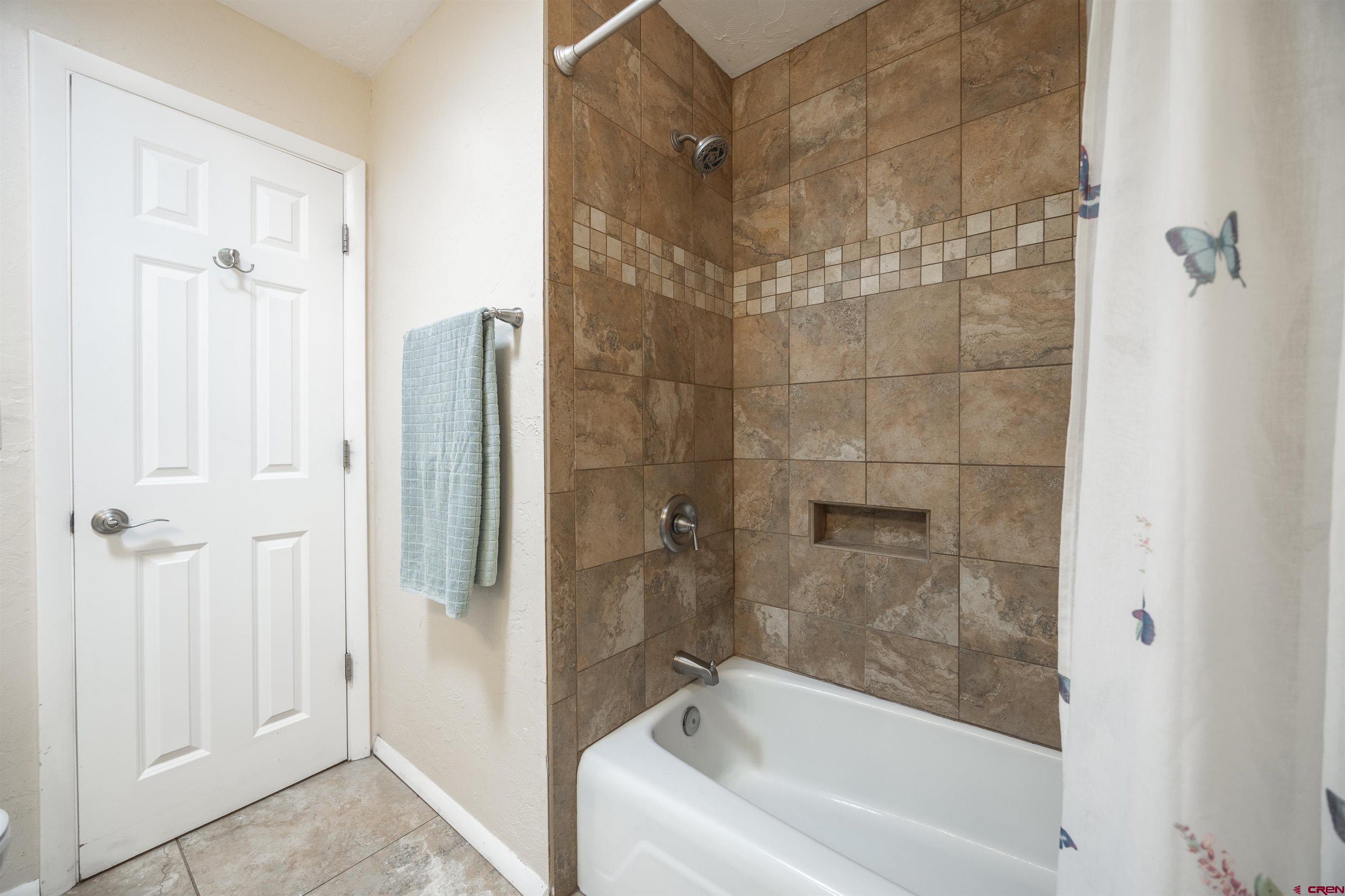 16574 6275th Road Montrose, CO 81403 - Photo 25 of 45 a bathroom with a bathtub